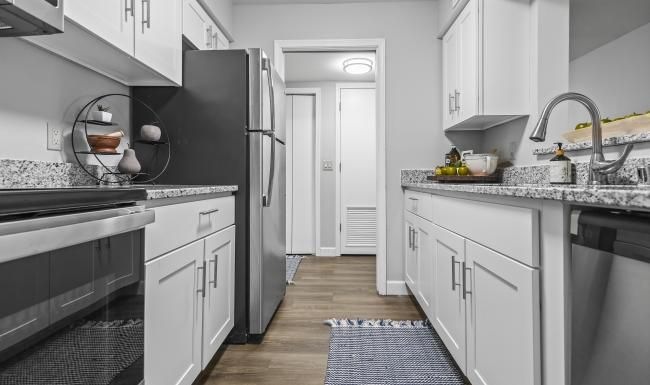 a kitchen with white cabinets