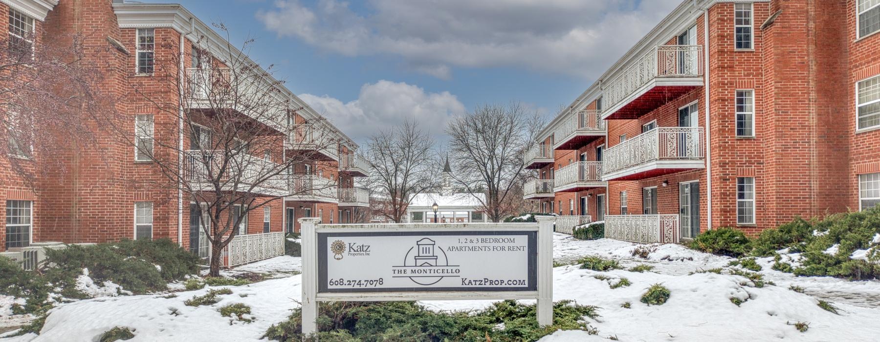 a sign in front of a building