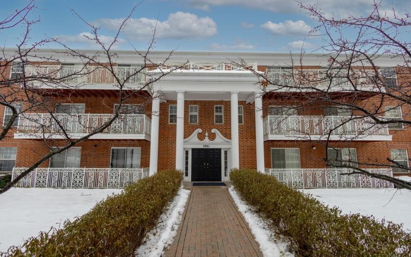 a brick building with a walkway