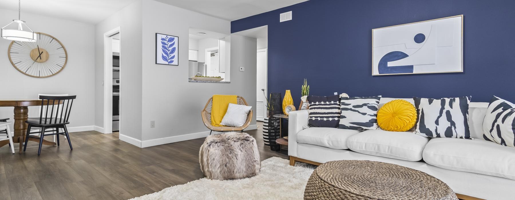 a living room with a couch and a rug